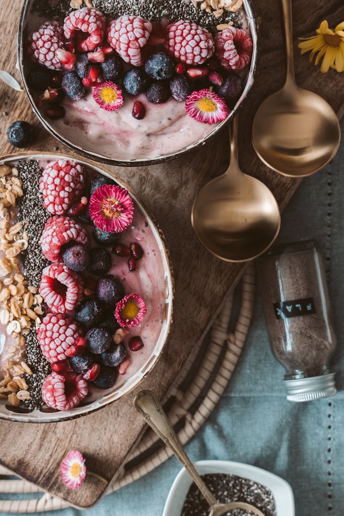 Delicious smoothie bowls topped with fresh berries, perfect for a healthy breakfast.